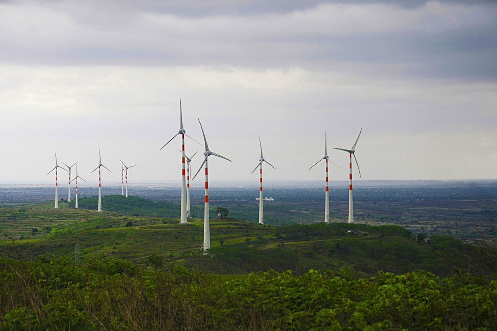 Windmills on green hills. Photo.