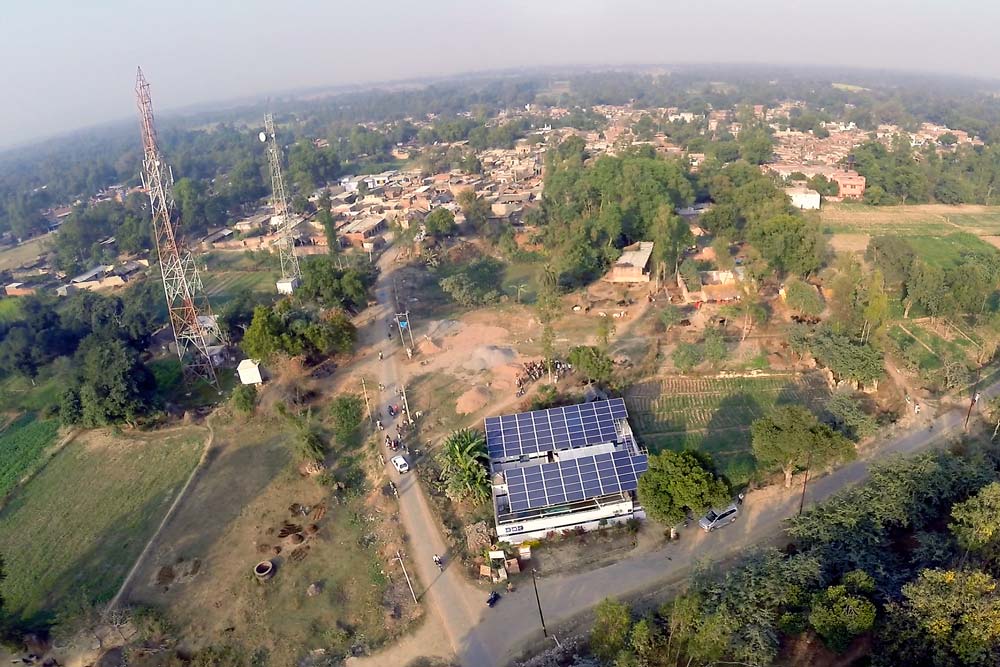 Solar panels in a rural village. Photo taken from above.