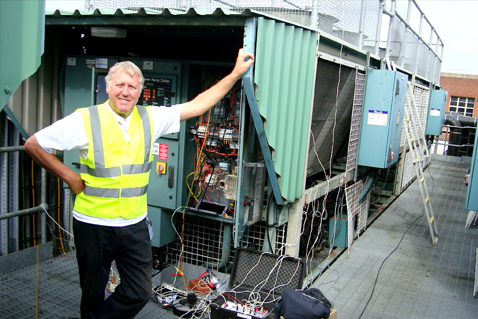 Swedish man in front of technical equipment. Photo.