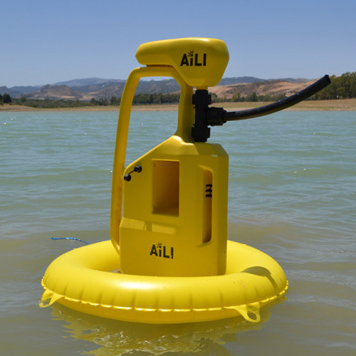 Yellow water pump in a lake. Photo.