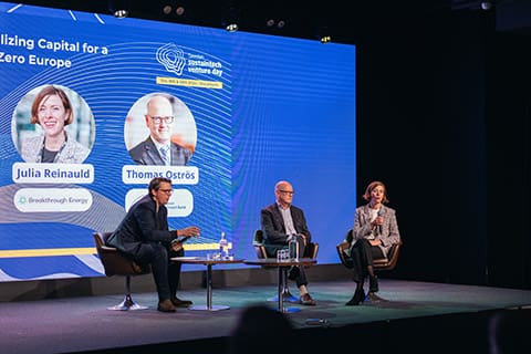 People talking on a stage.